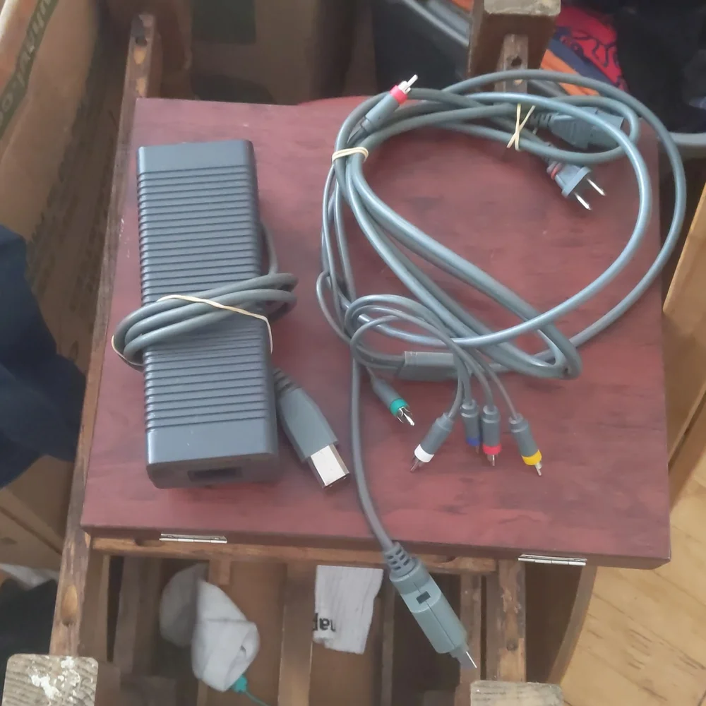 A external hard drive for an Xbox 360, and the cable connect cords.
